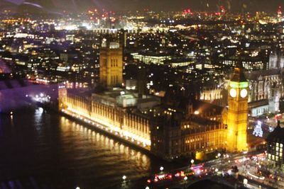 High angle view of city lit up at night