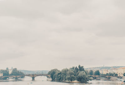 River amidst buildings against sky