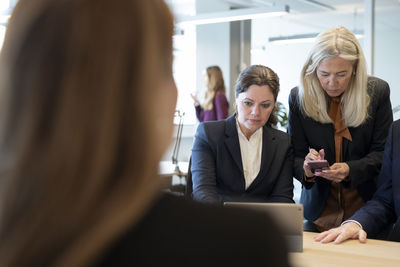 Businesswomen talking in office