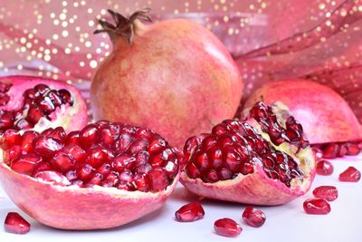 Close-up of pomegranate over white background