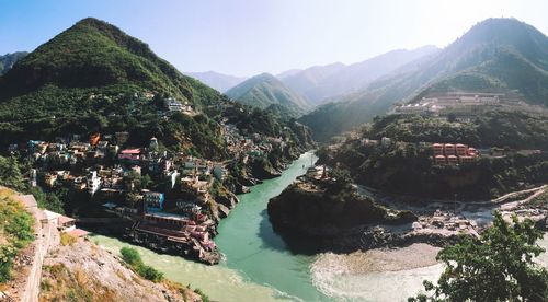 Panoramic view of buildings and mountains against sky