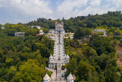 High angle view of trees and buildings against sky