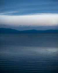 Scenic view of landscape against cloudy sky