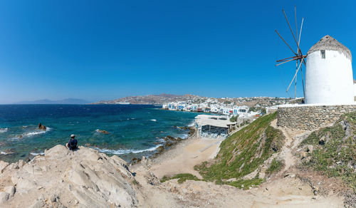 Scenic view of beach against clear blue sky