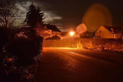 Illuminated road at night
