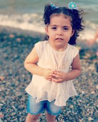 Portrait of girl standing on field