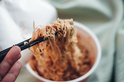 Close-up of hand holding food