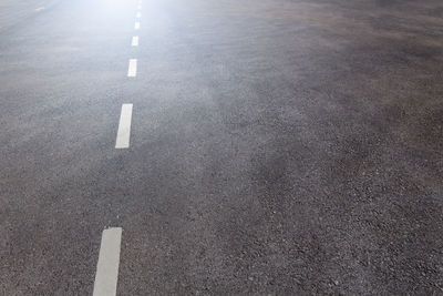 High angle view of arrow symbol on road