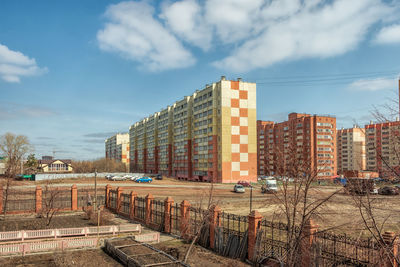 Buildings in city against sky