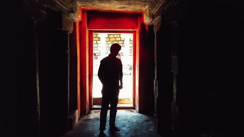 Silhouette people standing in front of building