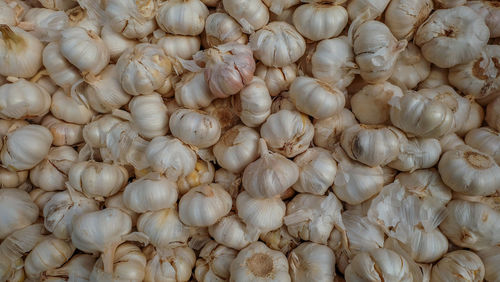 Full frame shot of onions for sale in market