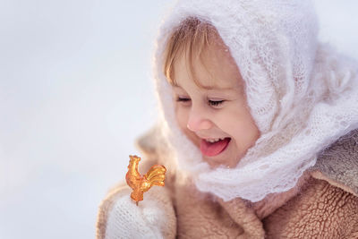 Cute girl playing with toy during winter