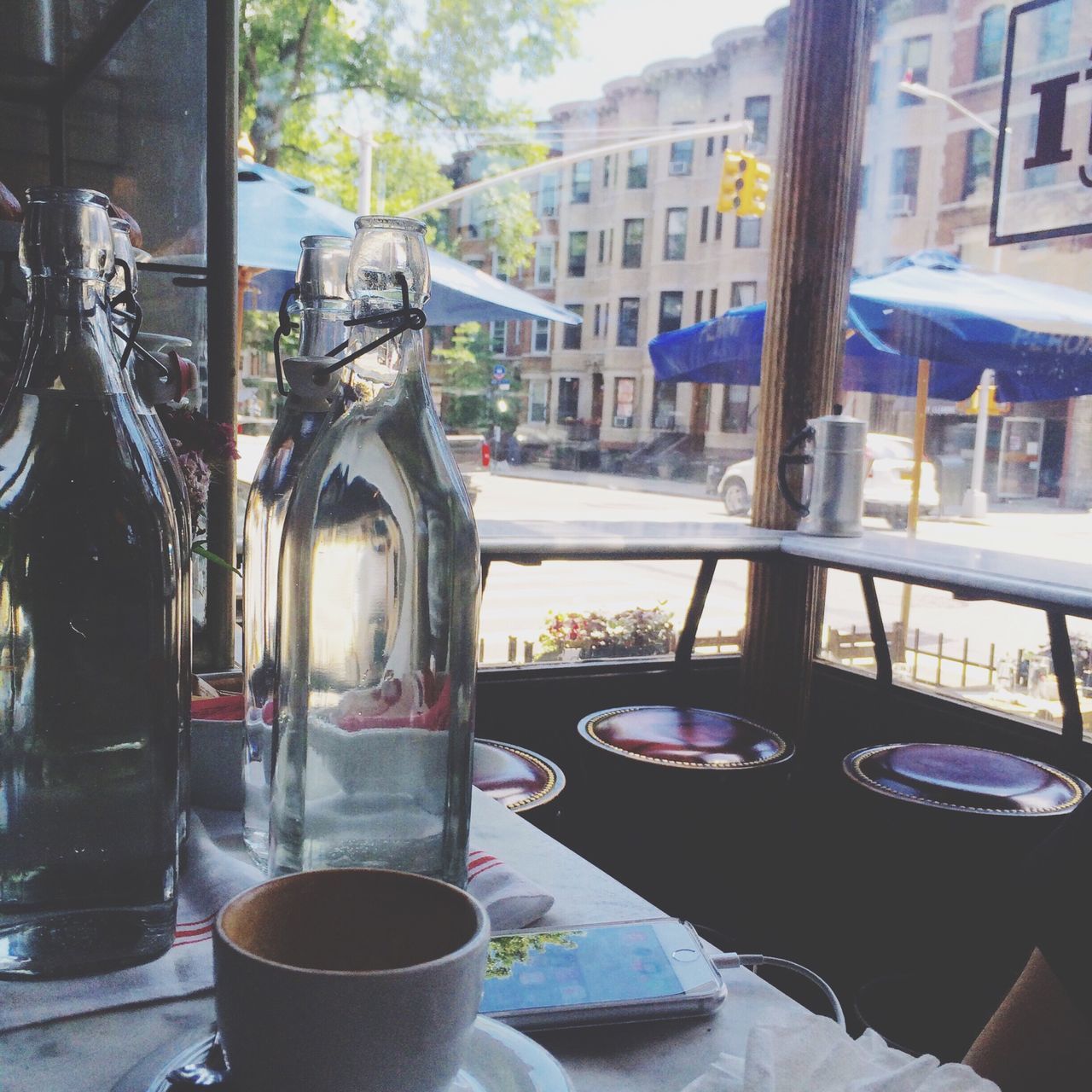 table, window, architecture, built structure, building exterior, chair, indoors, house, glass - material, absence, day, empty, food and drink, drink, transparent, no people, restaurant, sunlight, residential structure, residential building