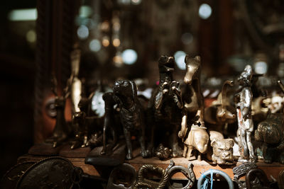 Close-up of old figurines on table