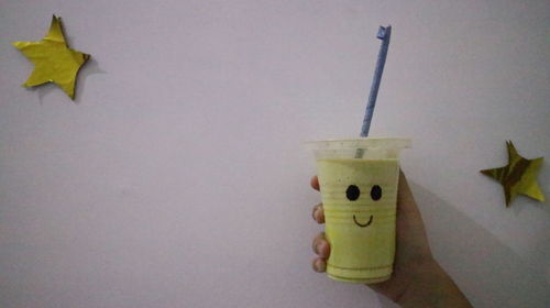 Close-up of drink on table against wall