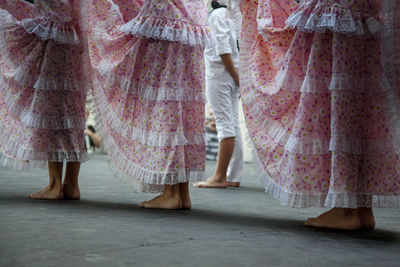 Low section of women standing on floor