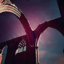 Low angle view of arch bridge against sky