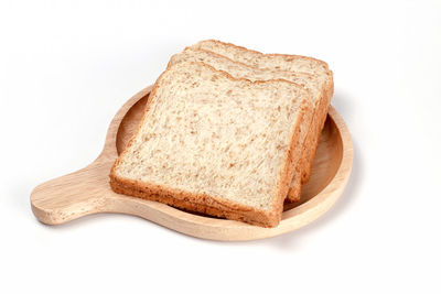 Close-up of cake slice against white background