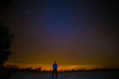 Scenic view of landscape against sky at night