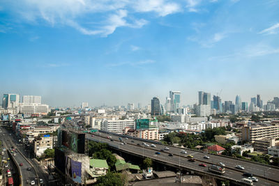 High angle view of city buildings against sky