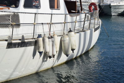 Row of boats moored in water