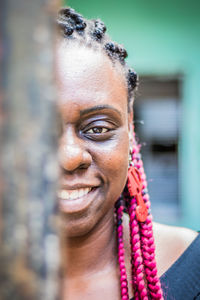 Close-up portrait of a smiling young woman