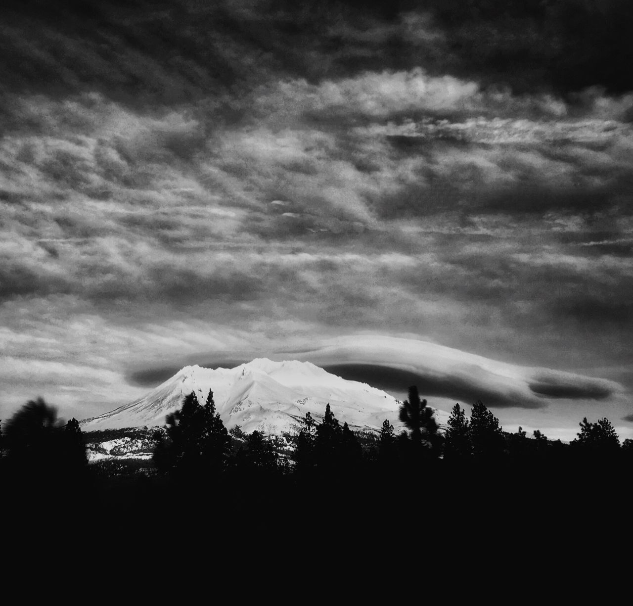 sky, scenics, tranquil scene, tranquility, cloud - sky, tree, beauty in nature, silhouette, cloudy, mountain, weather, nature, overcast, cloud, landscape, idyllic, mountain range, dusk, storm cloud, non-urban scene