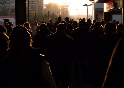 Rear view of crowd standing on street