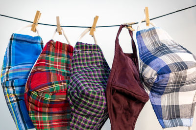 Low angle view of clothes hanging in rack