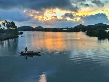 Scenic view of lake against sky during sunset