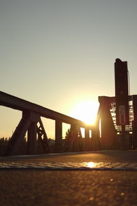 Sun shining through bridge