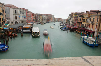 View of canal passing through city buildings