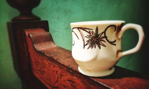 Close-up of coffee cup on table