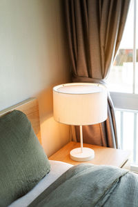 Close-up of chairs on table at home