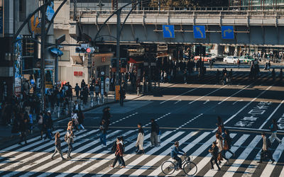 High angle view of people crossing road on ueno, tokyo