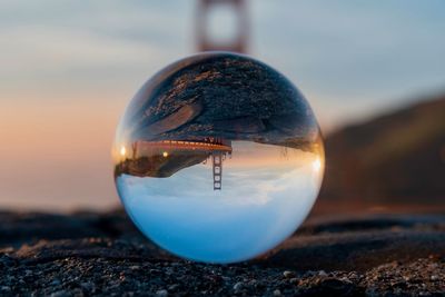 Close-up of crystal ball on rock