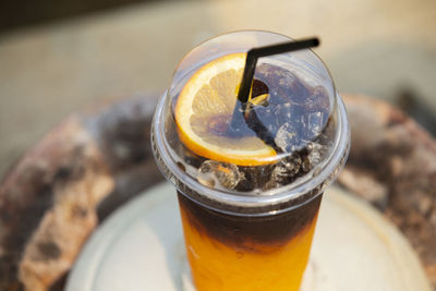 Glass of orange and coffee with ice