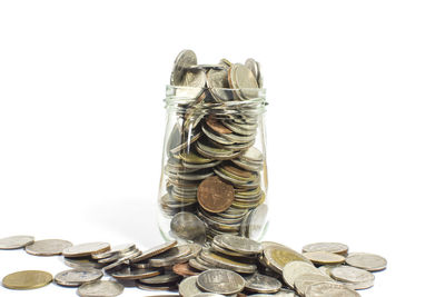 Close-up of coin stack against white background