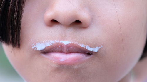 Close-up of milk stains on mouth