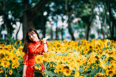 Young woman with yellow flowers
