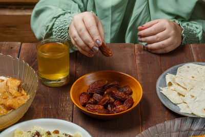 Midsection of man preparing food