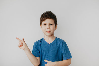 Portrait of young man against white background