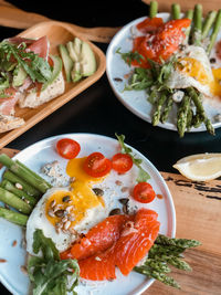 Fried eggs with salted salmon and asparagus 