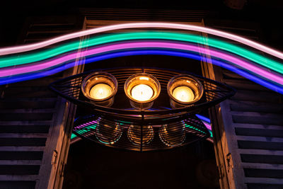 Low angle view of illuminated light on ceiling