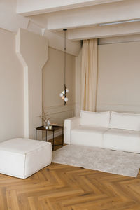 The real interior of a bright living room with a sofa with a modern minimalist scandinavian style