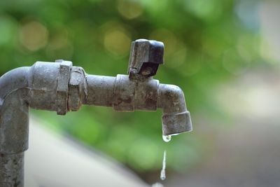 Close-up of water drops on rusty metal