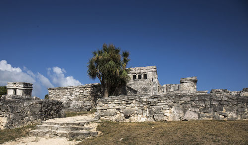 Old ruin building against blue sky