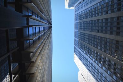 Low angle view of skyscrapers against clear sky