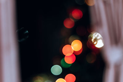 Defocused image of illuminated christmas lights