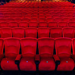 Full frame shot of empty chairs in auditorium